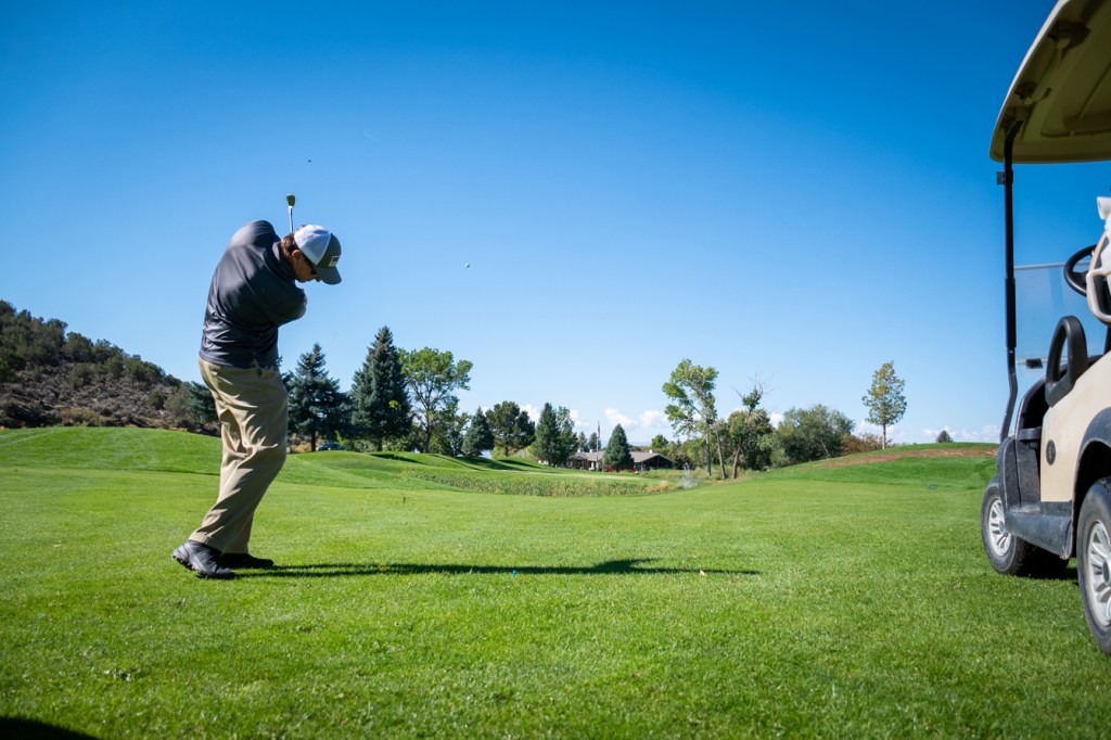 Golfer at Cedaredge Golf Course. Contact us for information about the course and hosting events.